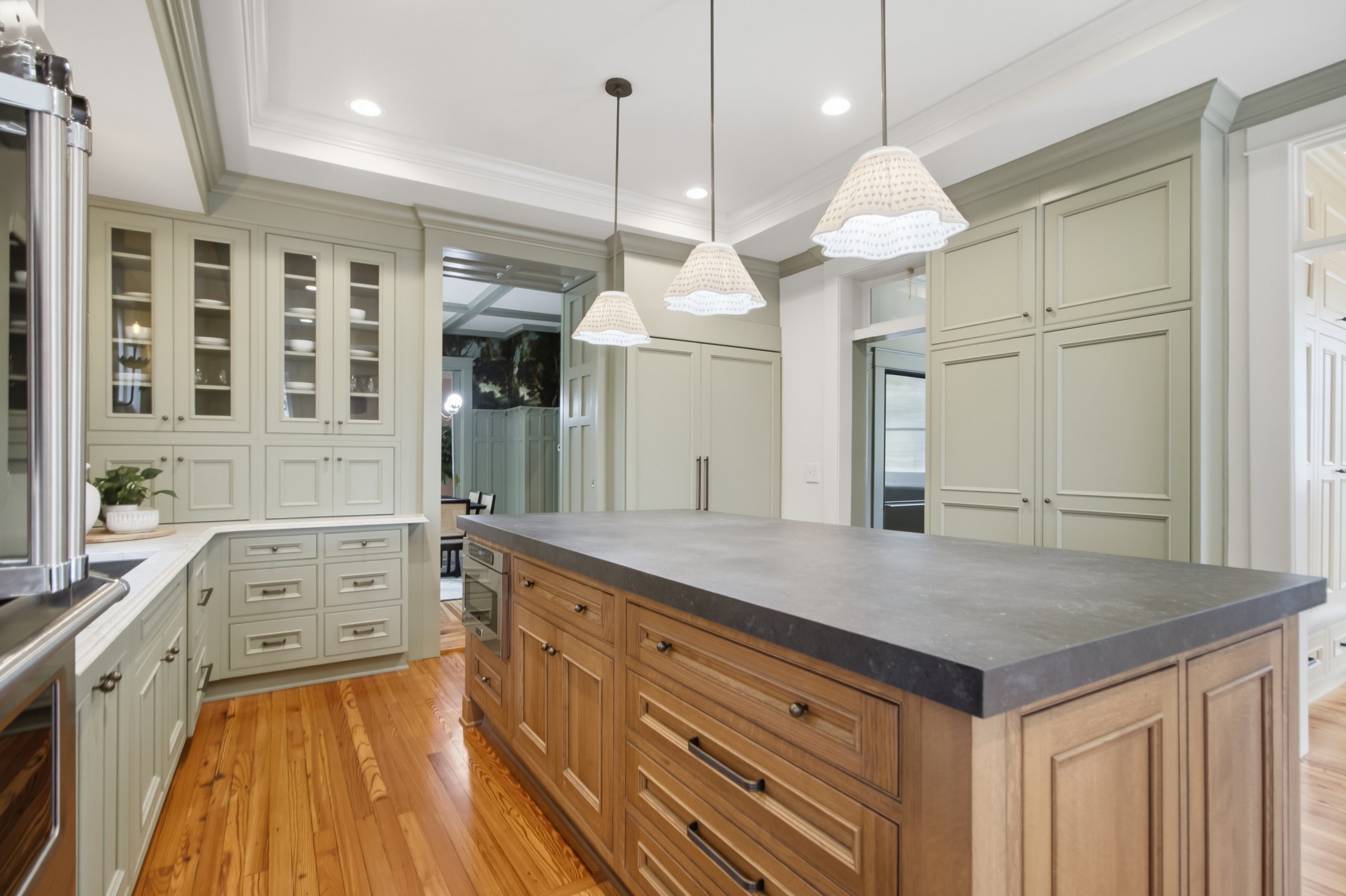 Contemporary kitchen with custom cabinetry and marble